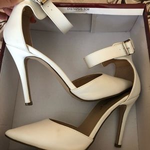 Breckelle’s White pointy heels